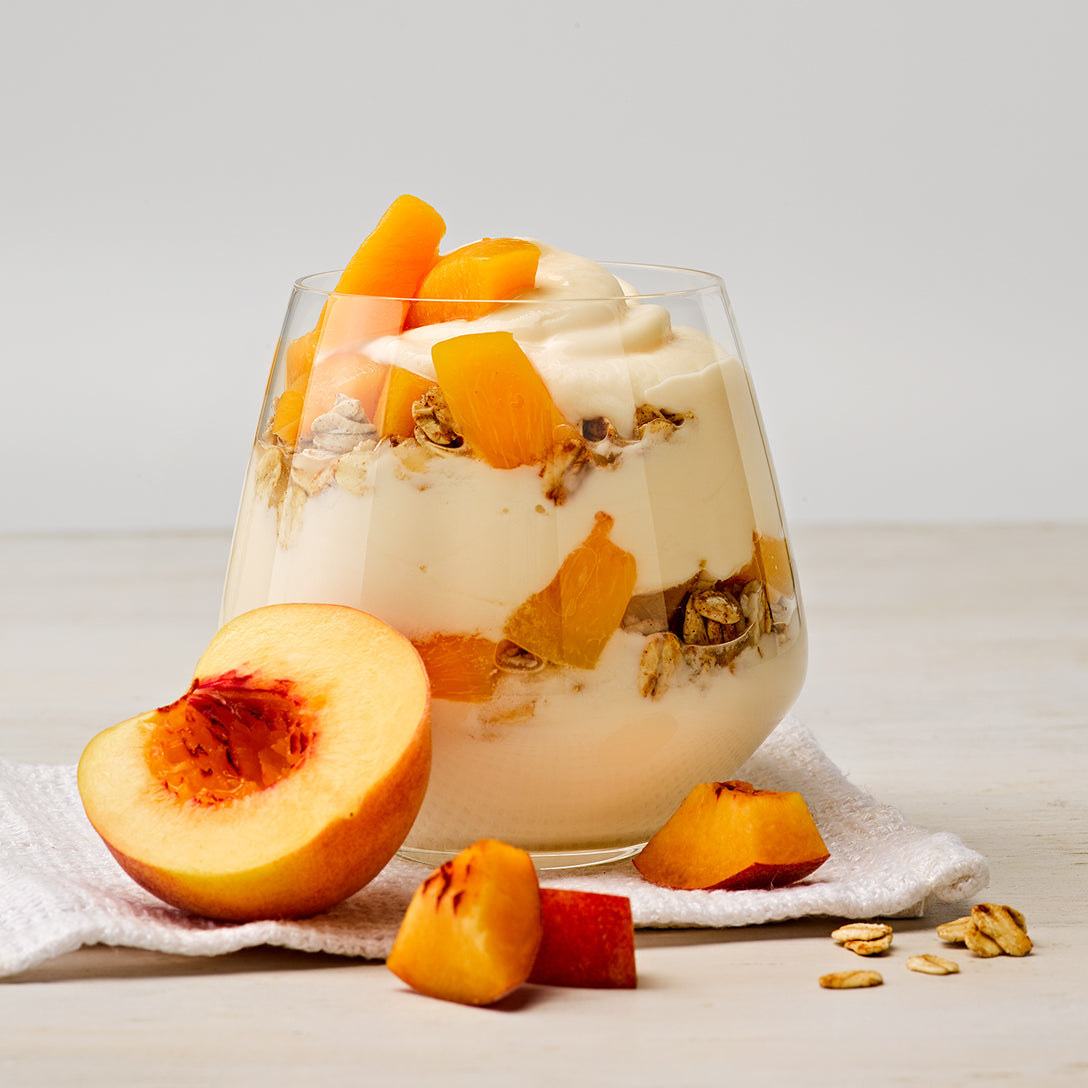 Fruity yogurt flavor in a cup with peaches